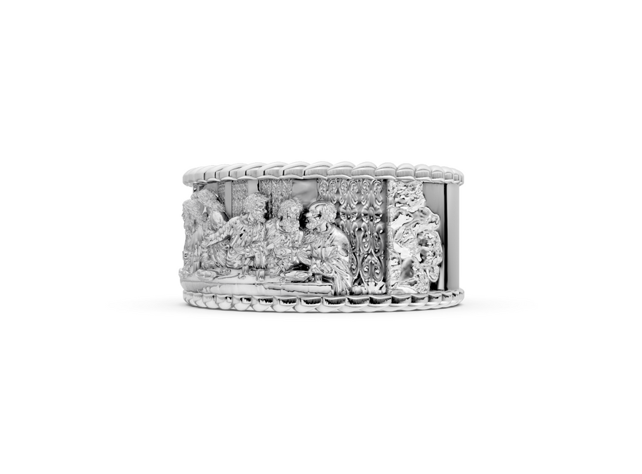 Silver ring with intricate design on a white background