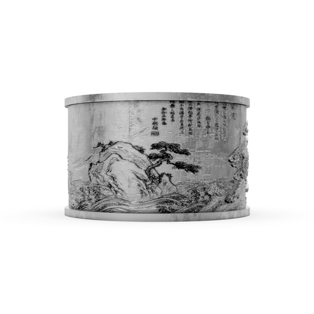 Decorative cylindrical object with engraved landscape and text on a white background