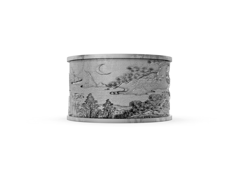 Decorative silver ring with engraved landscape design on a white background