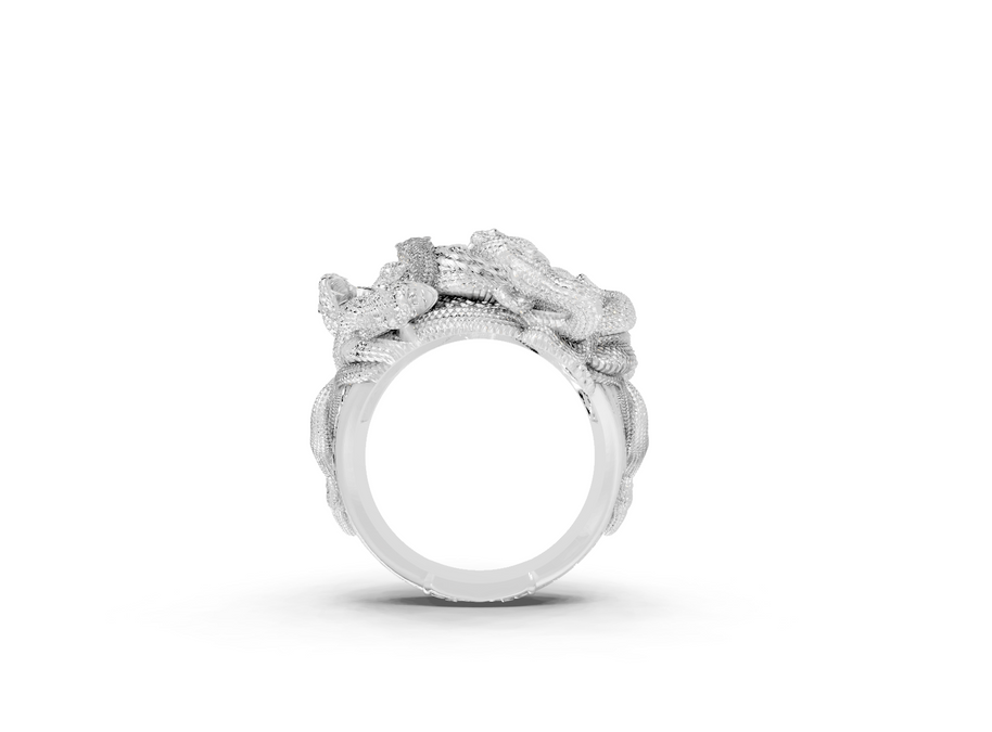 Silver ring with floral design on a white background