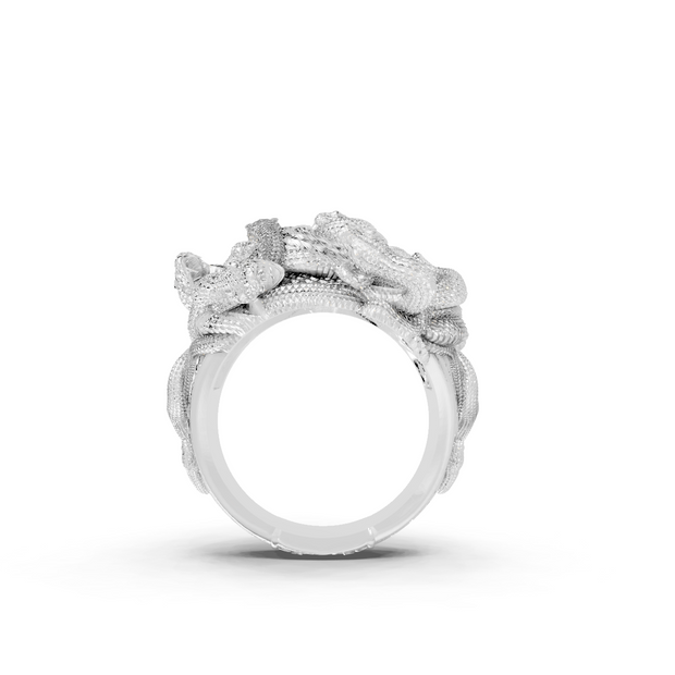 Silver ring with floral design on a white background