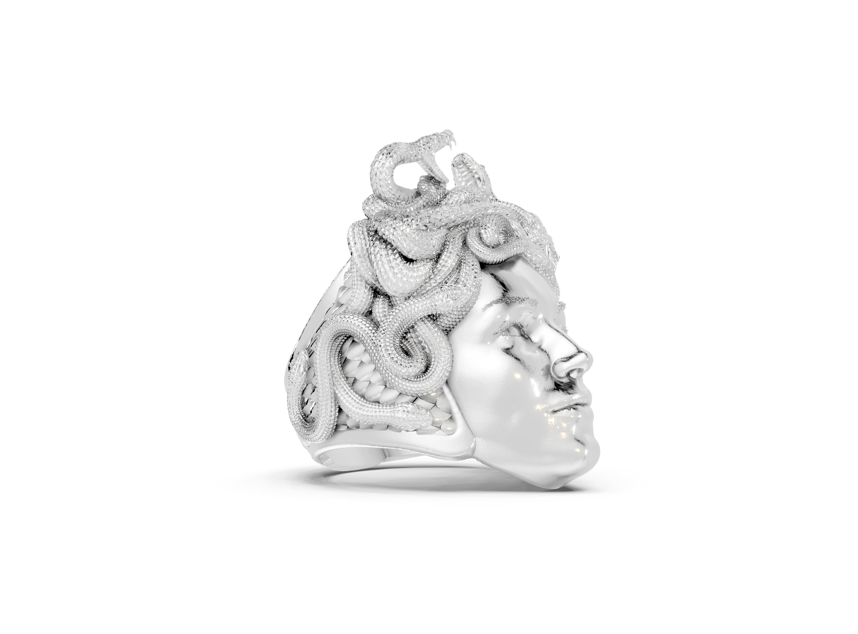 Silver ring with intricate design on a white background