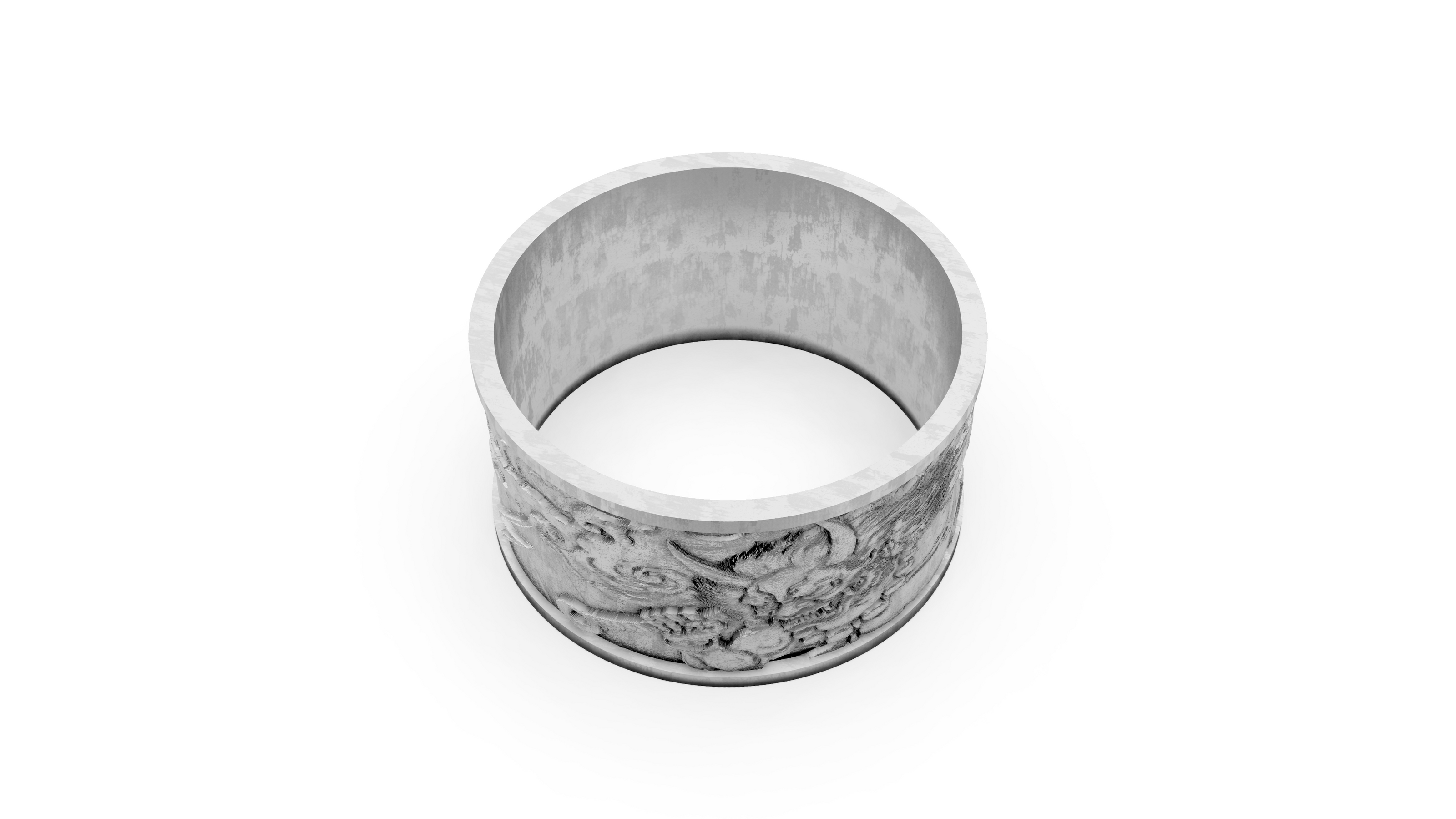 Silver ring with intricate design on a white background