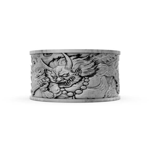 Silver ring with dragon design on a white background