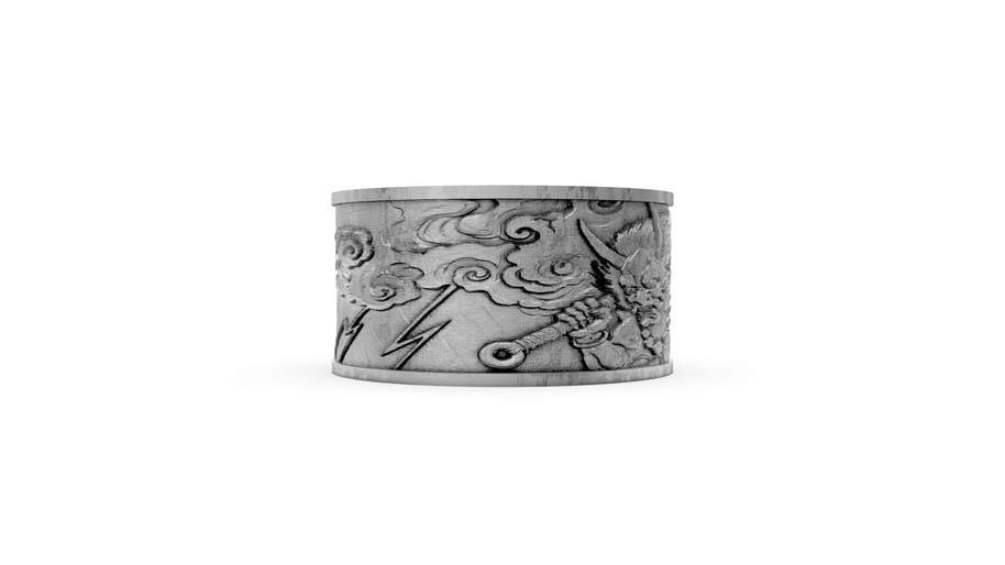 Silver cuff bracelet with intricate designs on a white background