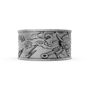 Silver cuff bracelet with intricate designs on a white background