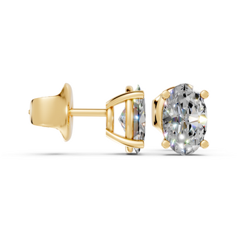 oval studs front and angled in yellow gold