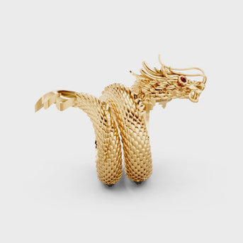 A dragon coiled twice to form a large ring. It has ruby eyes and whiskers above its head.