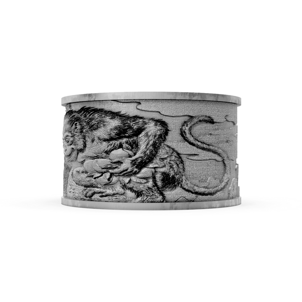 Silver cuff bracelet with a monkey design on a white background