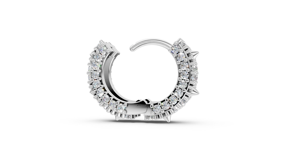 Silver hoop earring with clear gemstones on a white background