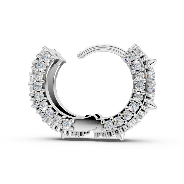 Silver hoop earring with clear gemstones on a white background